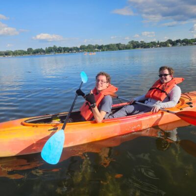 two participants in a tandem kayak